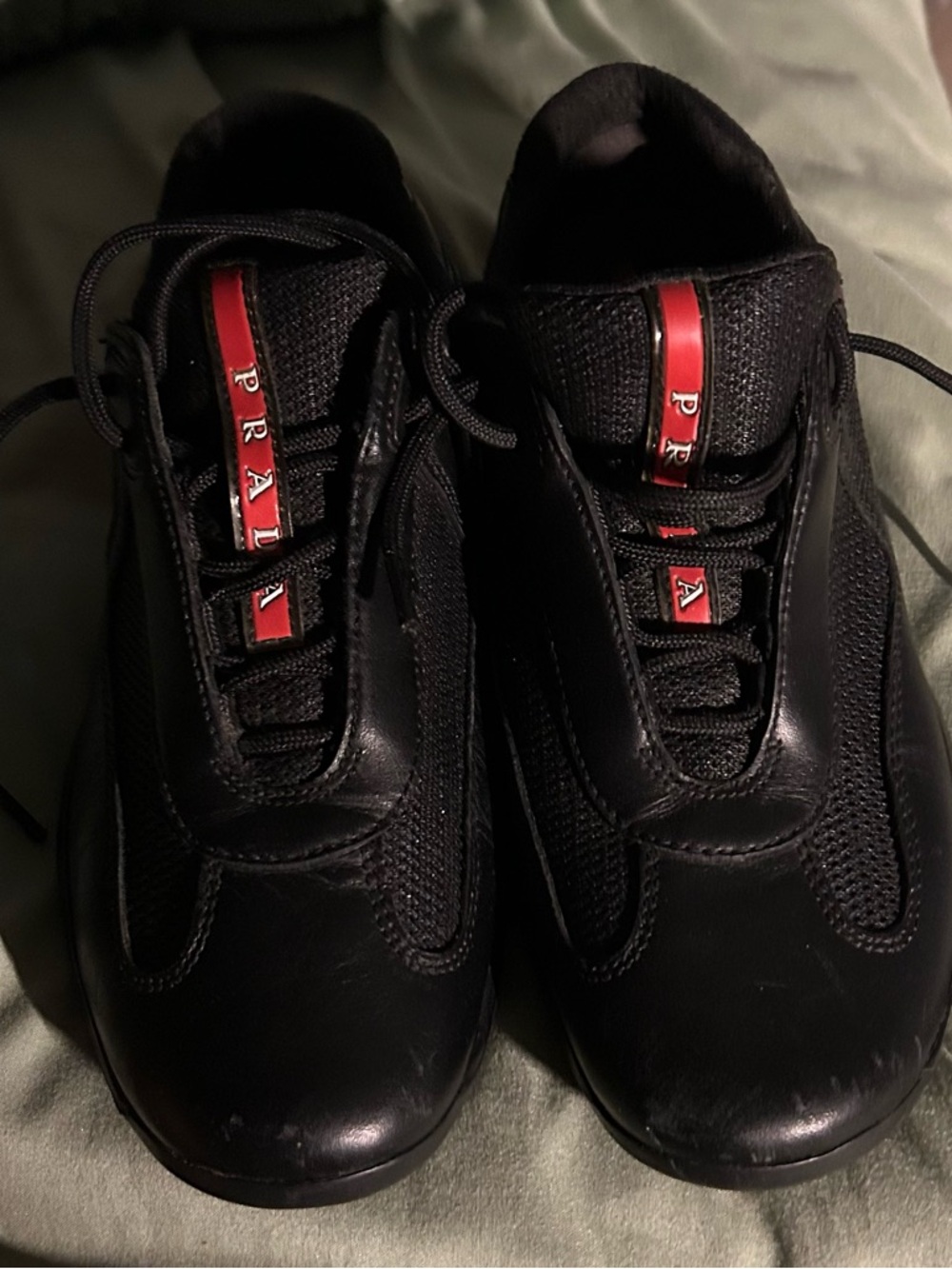 Prada Black Low-Top Sneakers with Red Logo Strips
